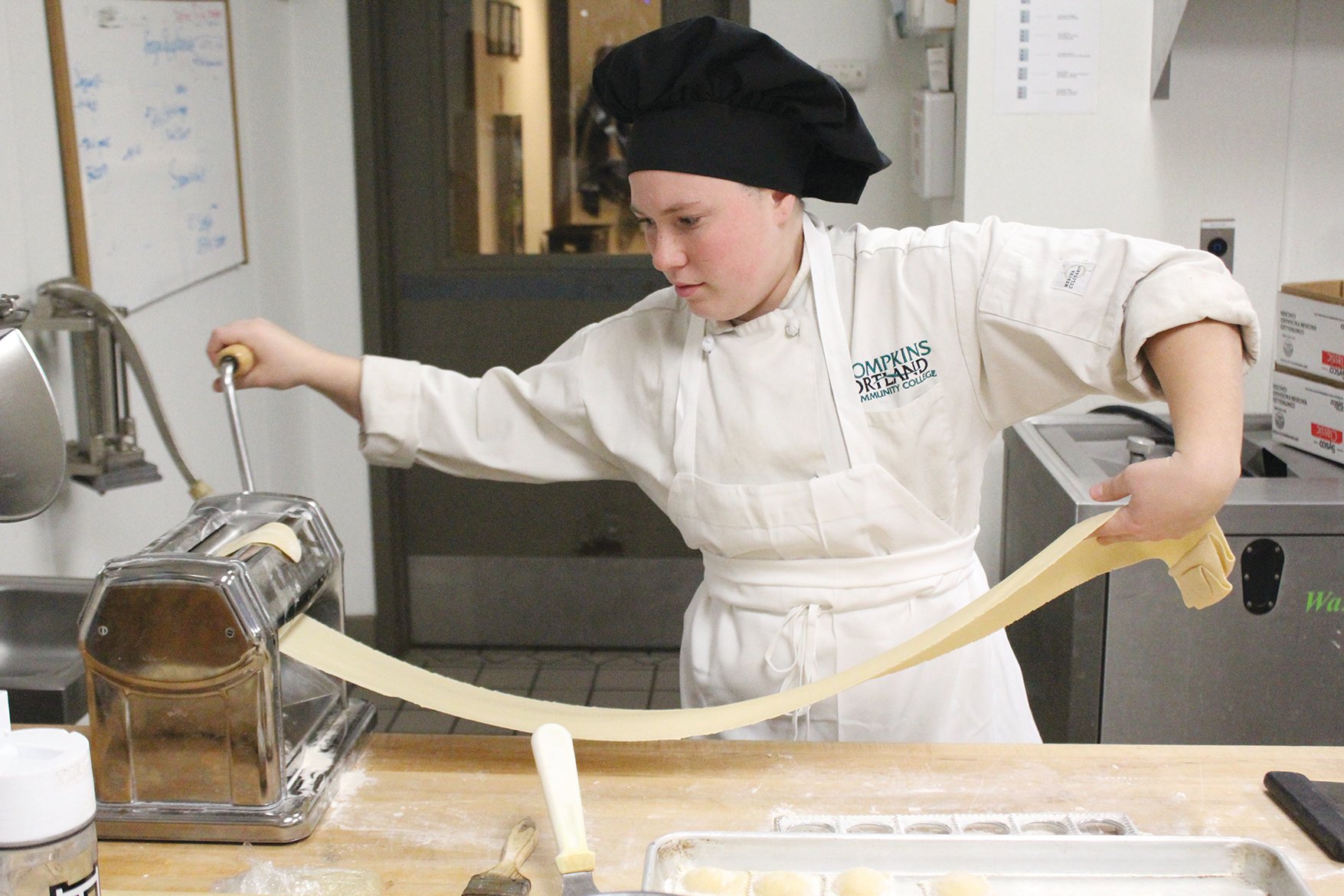 Dasia Herrmann prepares the dish she has created for Tasteful Sensations in the Coltivare kitchen. In the weeks leading up to the event the students practice making their dishes and works with the wine marketing students to pair them with the right wine.