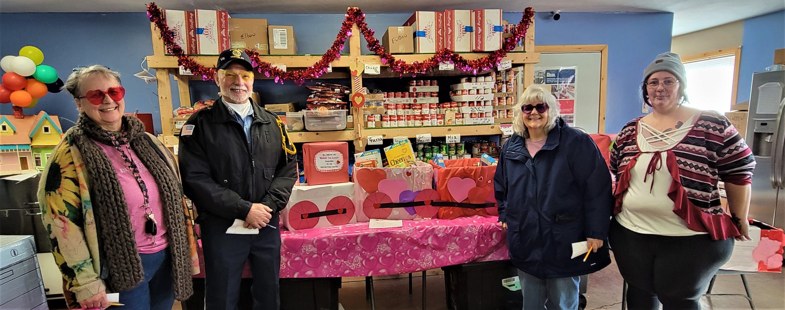 The judges for the Groton Food Providers "Share the Love" food drive contest and the GFP coordinator, Jessamine (Jess) Stone, stand beside the Crossroads Restaurant & Poker League's "train" of boxes, which took the "Best in Show" award. Left to right: Ruth Dilger Williams, Robert (Bob) Yachinich, Pastor Sharon Newman, and Jessamine (Jess) Stone, Groton Food Providers coordinator. 