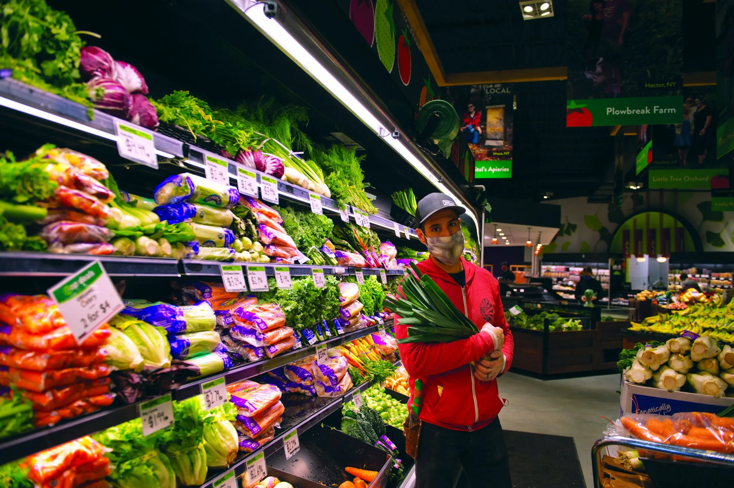 a customer stands in front of the produce section at GreenStar
