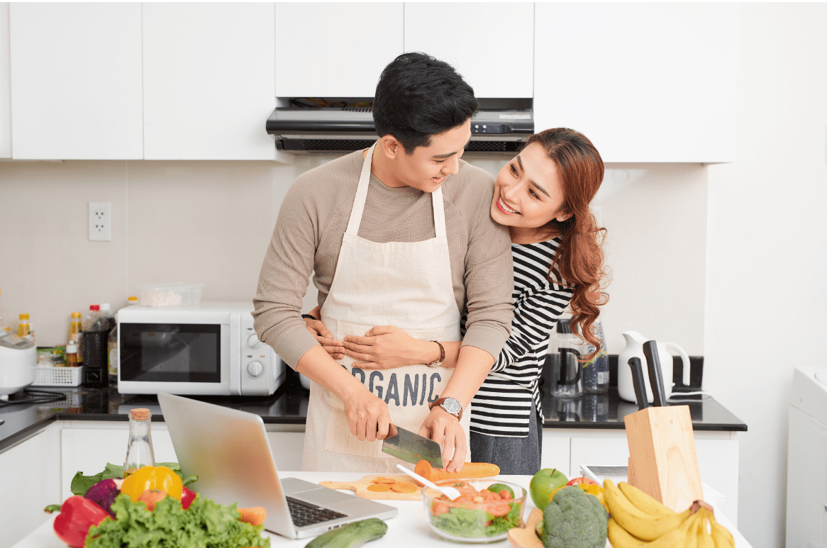 a couple embracing in a kitchen