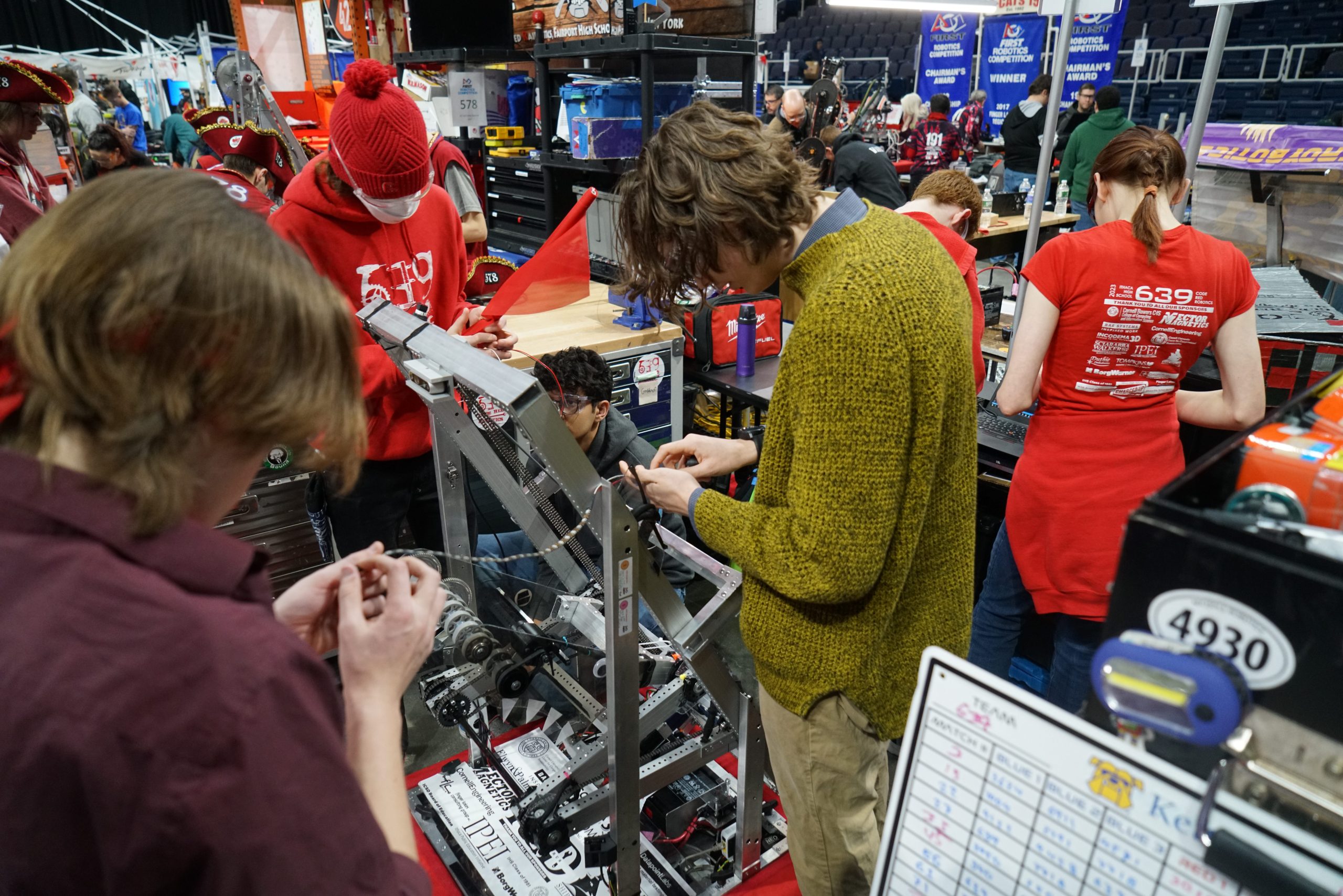 students repairing a robot 