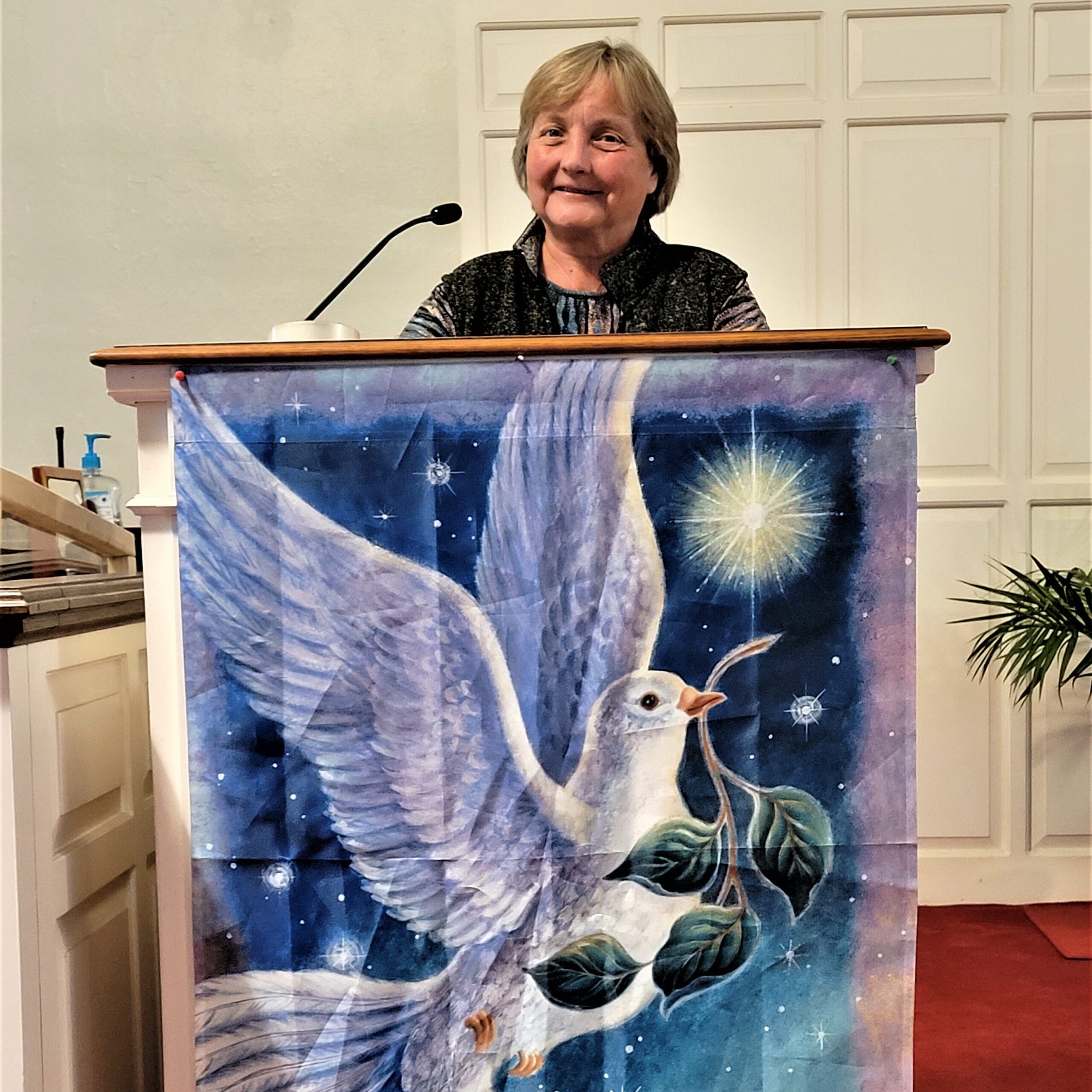 Pastor Barbara Blom in the pulpit of the Groton Community Church, United Church of Christ. She was called as the new pastor just prior to Easter 2023.