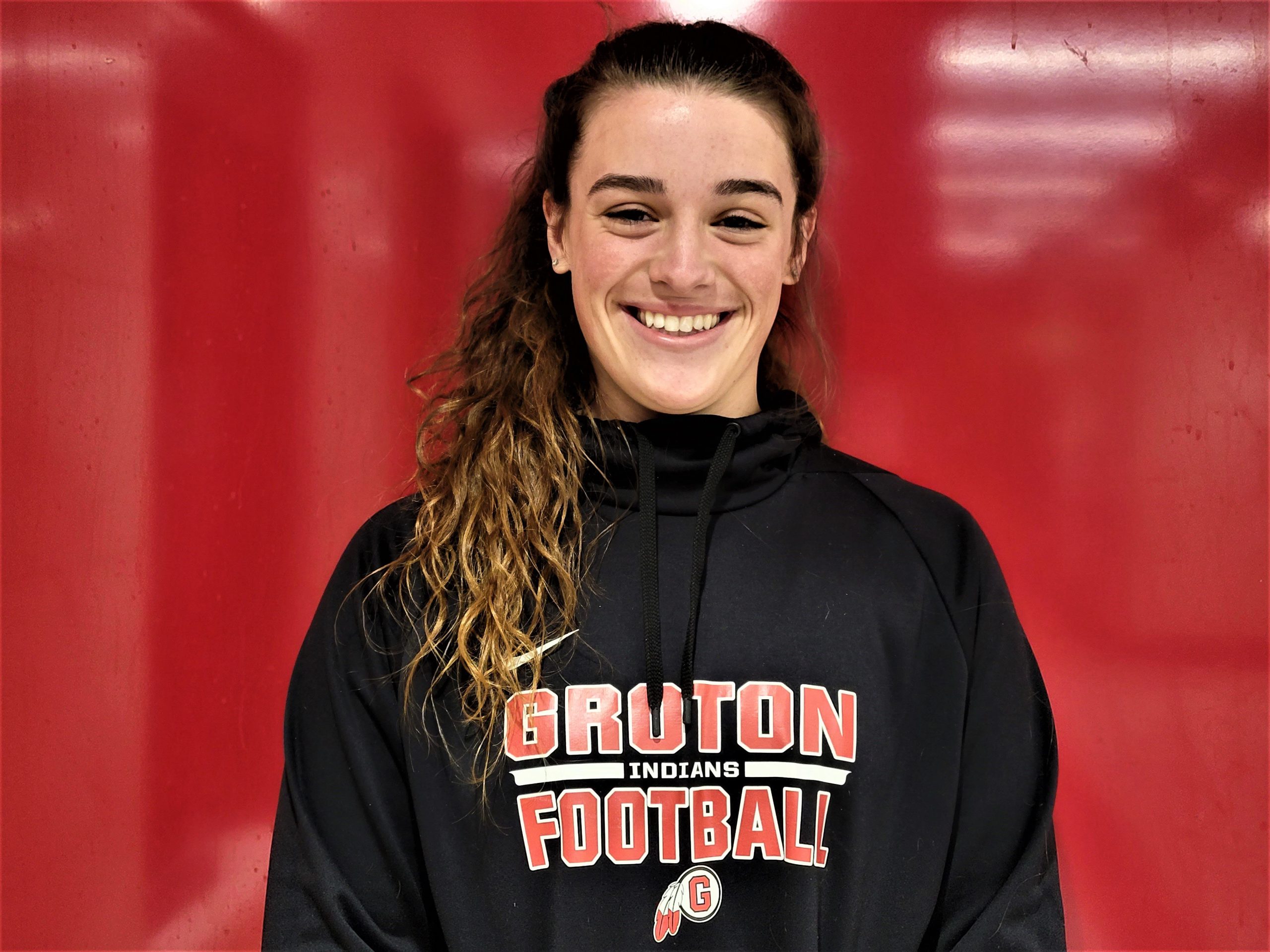 Elisa ALlen with a Groton football hoodie on