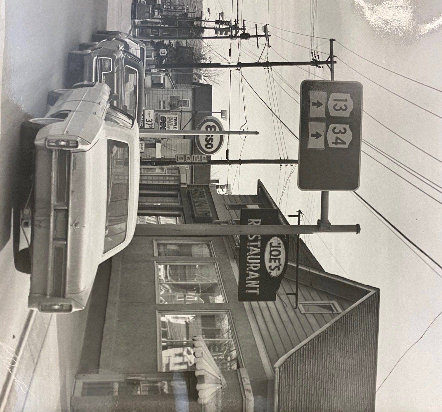 a black and white photo from the outside of Joe's