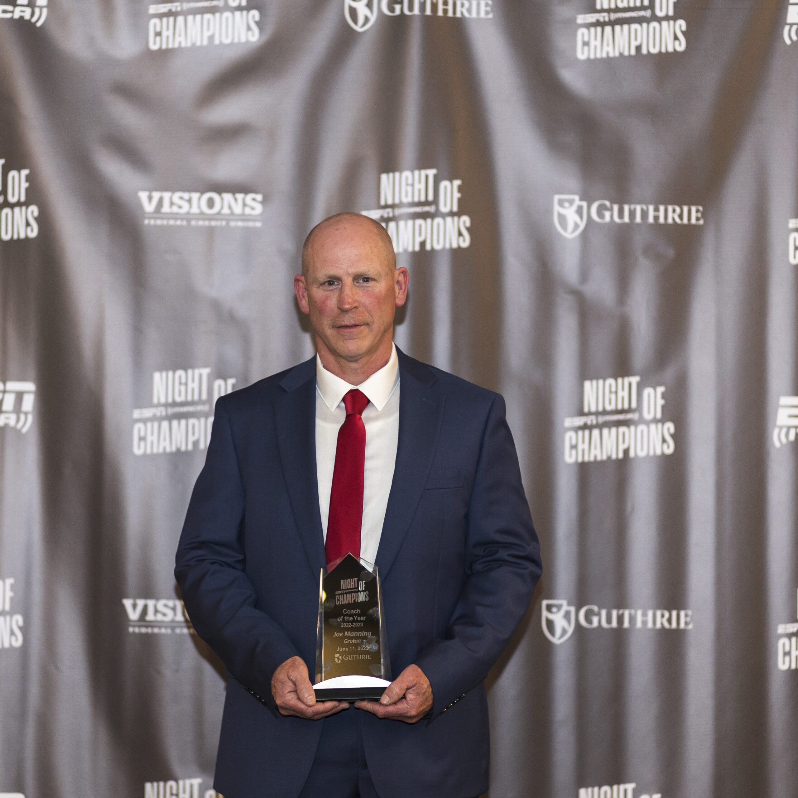 Groton football head coach Joe Manning holds his ESPN Ithaca Coach of the Year trophy during the 10th annual Night of Champions awards ceremony on June 11. Manning led the program to a 11-1 record and an appearance in the 8-man regional championship.