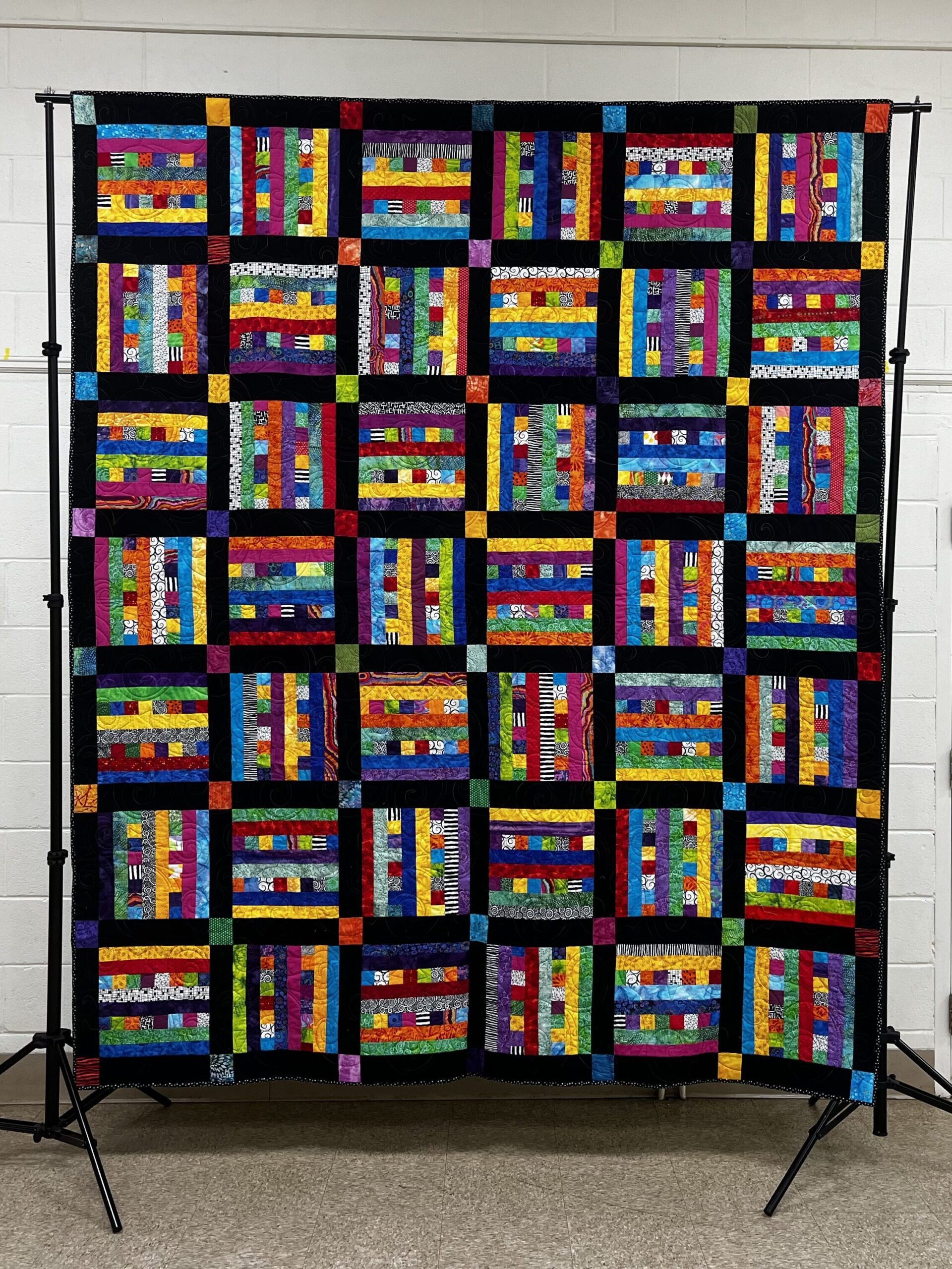 a multicolored block quilt