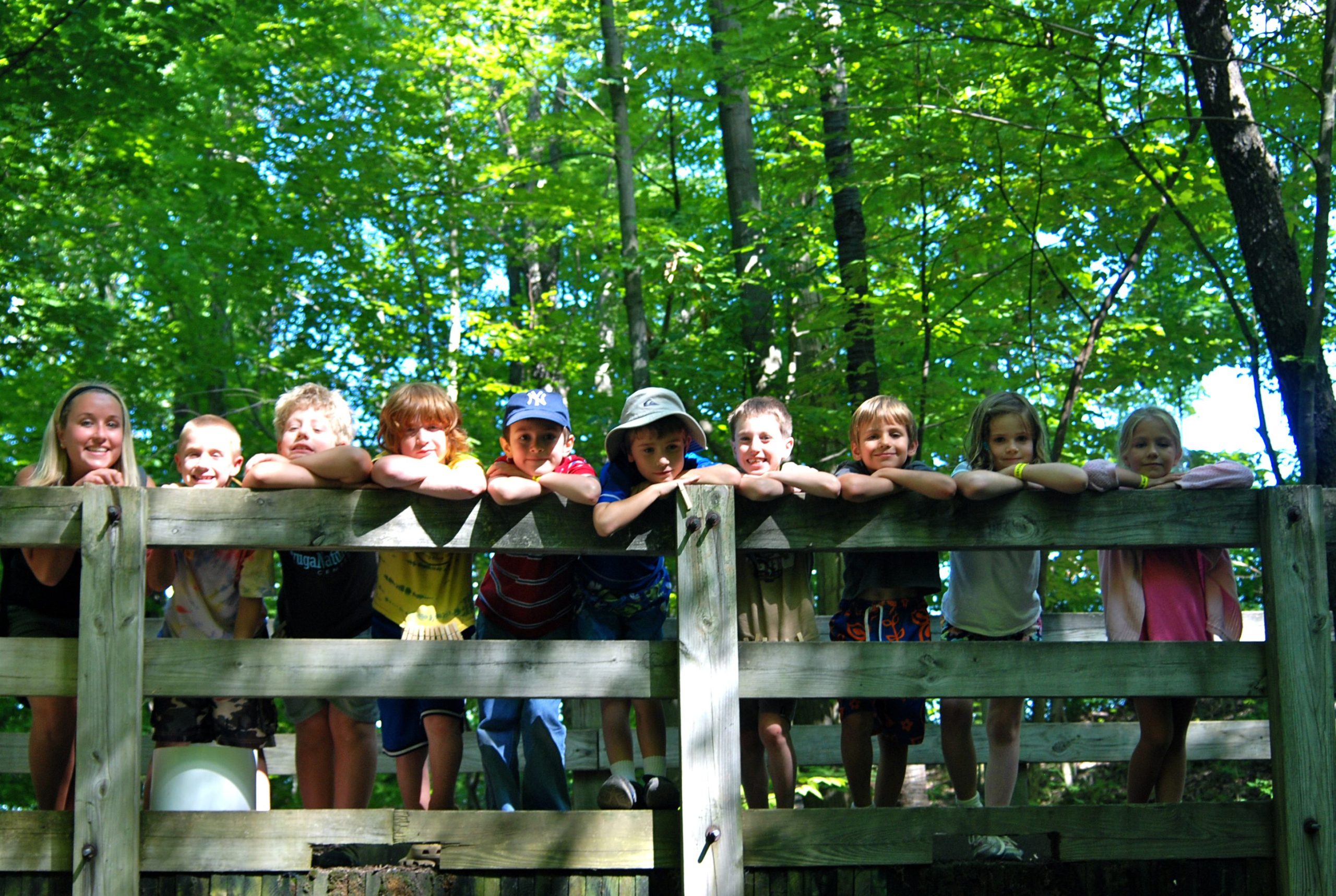 A camp counselor and group of children visit the Cayuga Nature Center for their 2022 Summer Celebration. 
