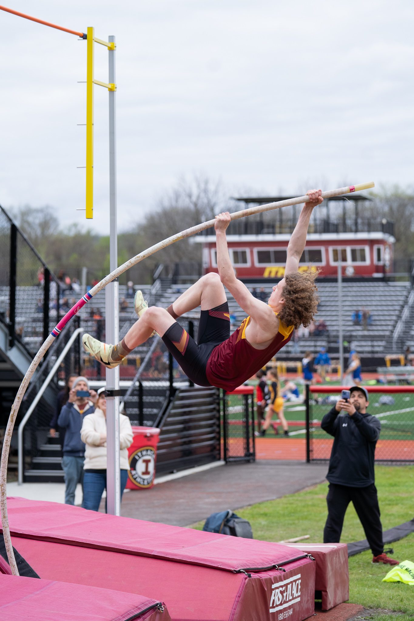 Athlete vaulting with pole 