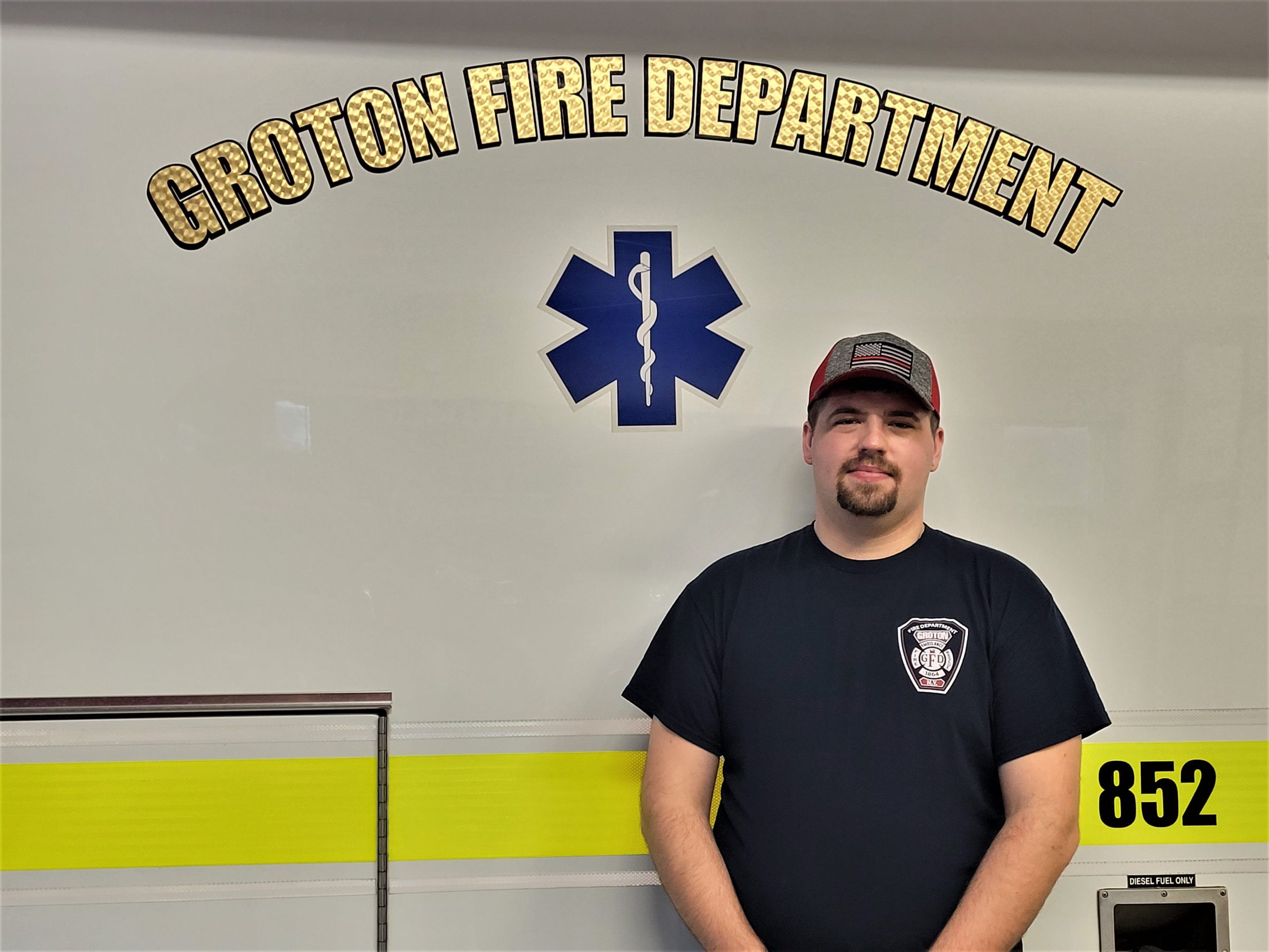 Matt stands in front of the fire department