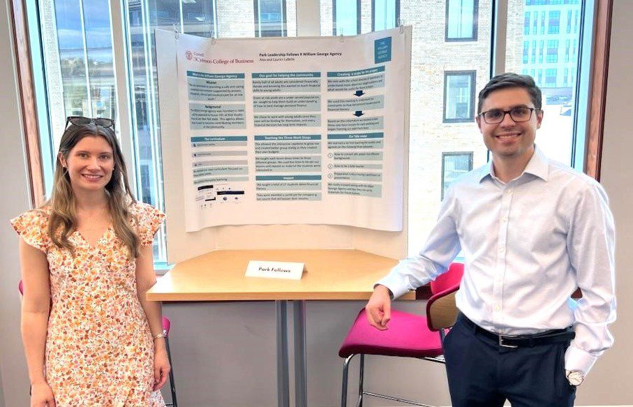 Lauren and Alex LaBelle at Cornell's Community Engagement Showcase on May 1 with a poster presentation about the financial literacy project they developed to benefit youth. Photo provided