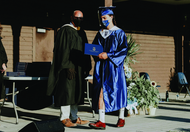 A close-up at a barrel full of apples that are faded yellow in color, a sign of their low water content.