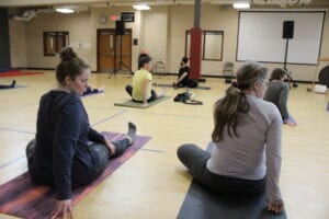 Lex Santi teaches a yoga class at the Family and Children's yoga fundraiser this past Saturday. The organization takes a holistic approach to mental health, including relaxation techniques including yoga and meditation.