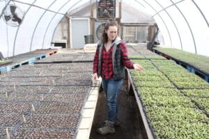 Molly Flerlage walks through the early plantings at Stick and Stone Farm.