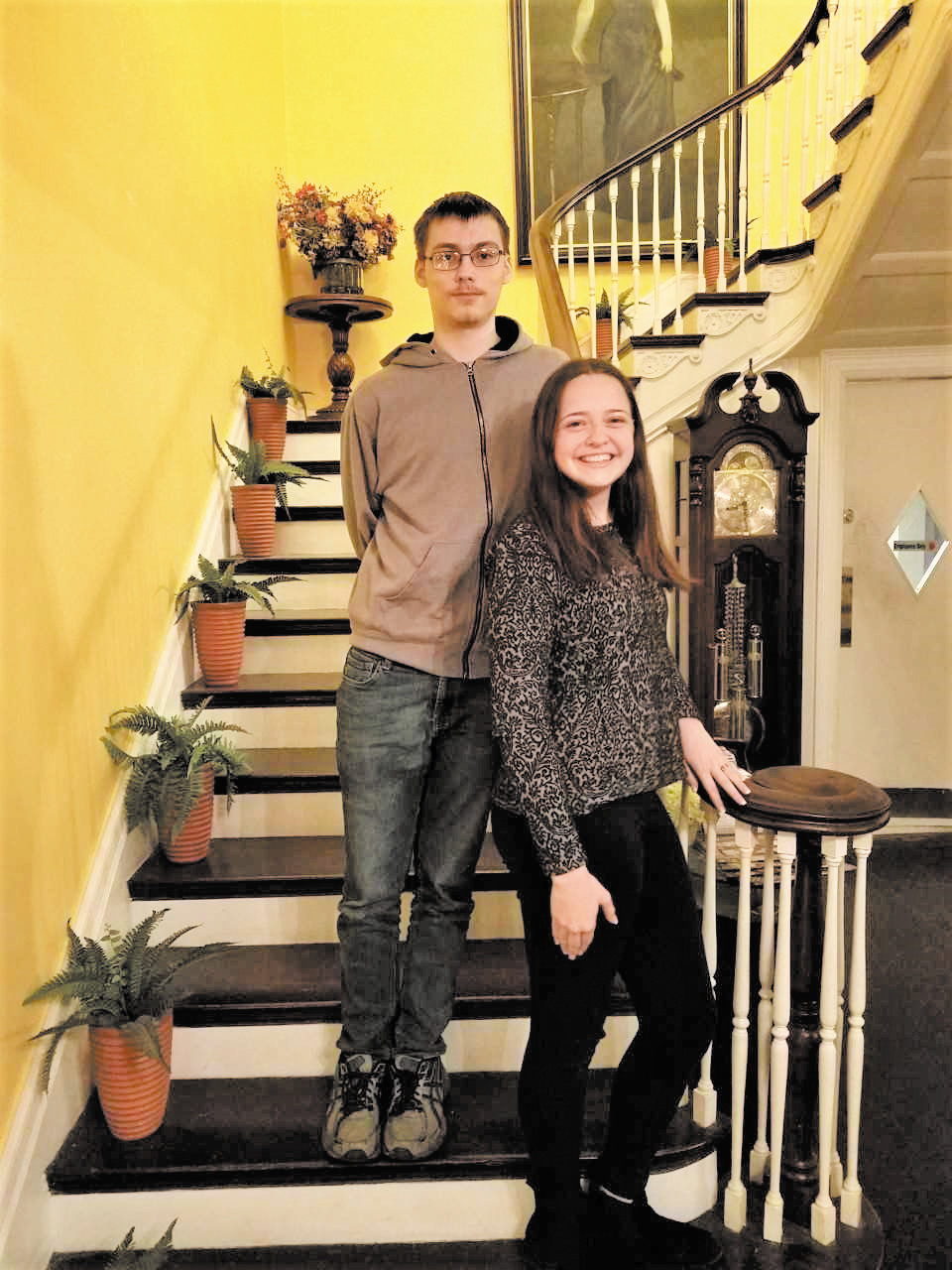 Diaz Niño (left) and Madeline (Maddie) Stamm, posed on the staircase of the Benn Conger Inn. The students were honored at a celebratory dinner Wednesday, May 15, as they will both graduate from TC3 the same year they graduate from Groton High School.