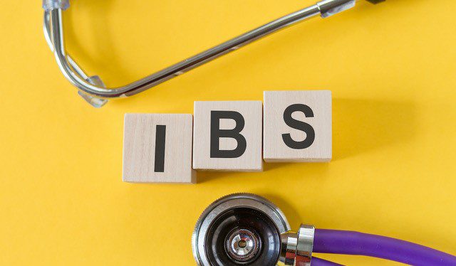 tiles with the letters I-B-S on a yellow background with a stethoscope nearby