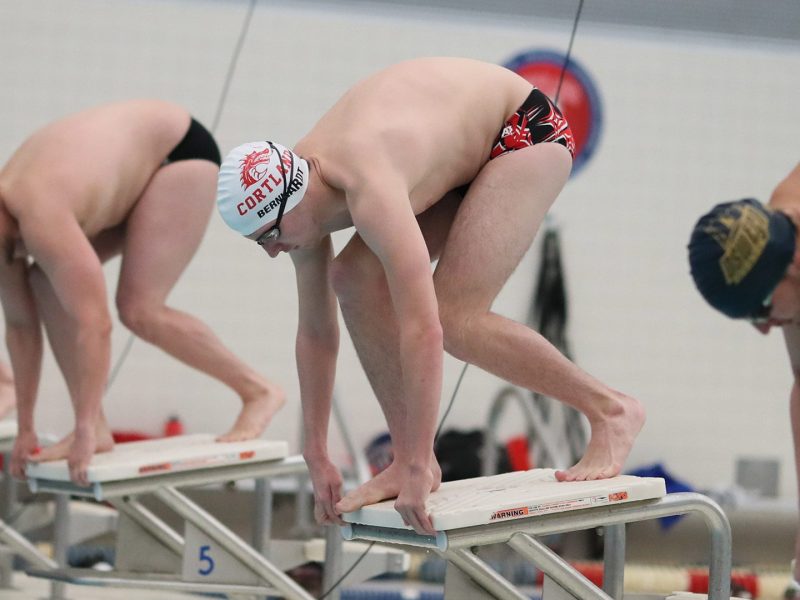Hunter and competitors preparing to dive into the pool