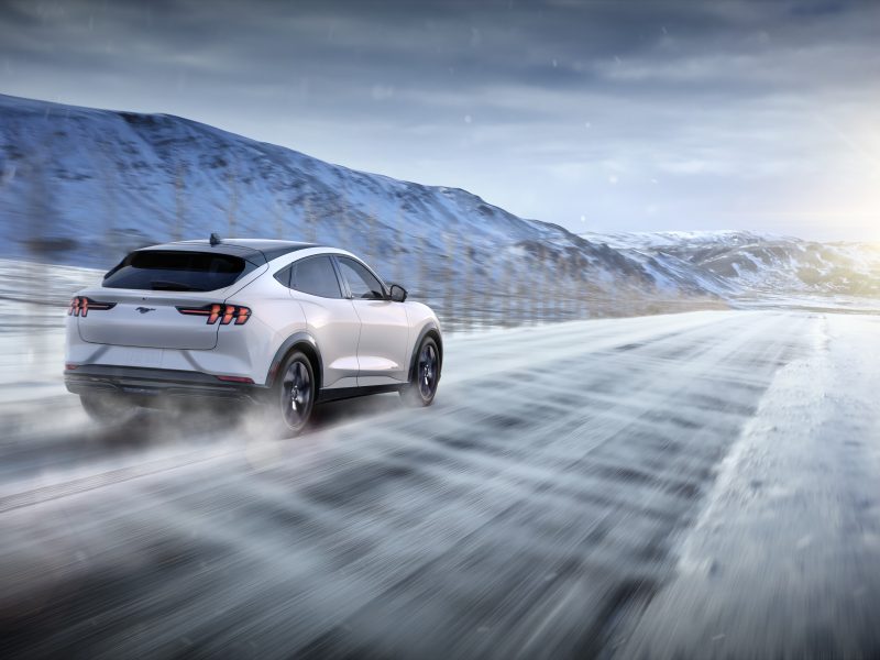 an electric vehicle on a snowy road
