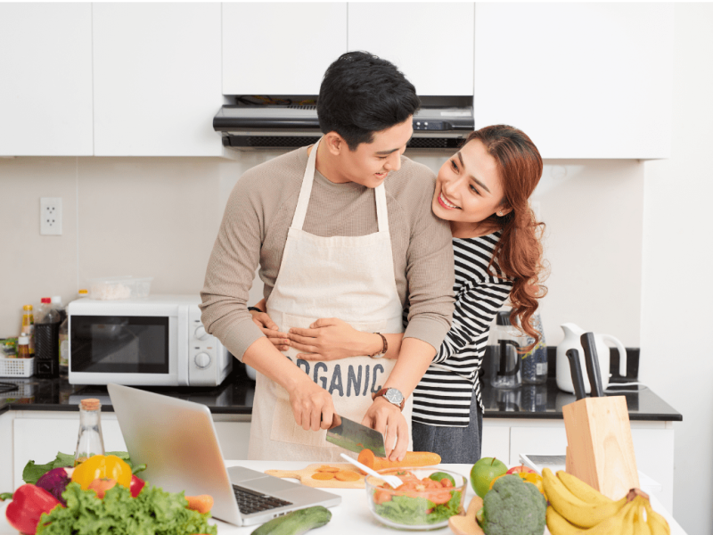 a couple embracing in a kitchen