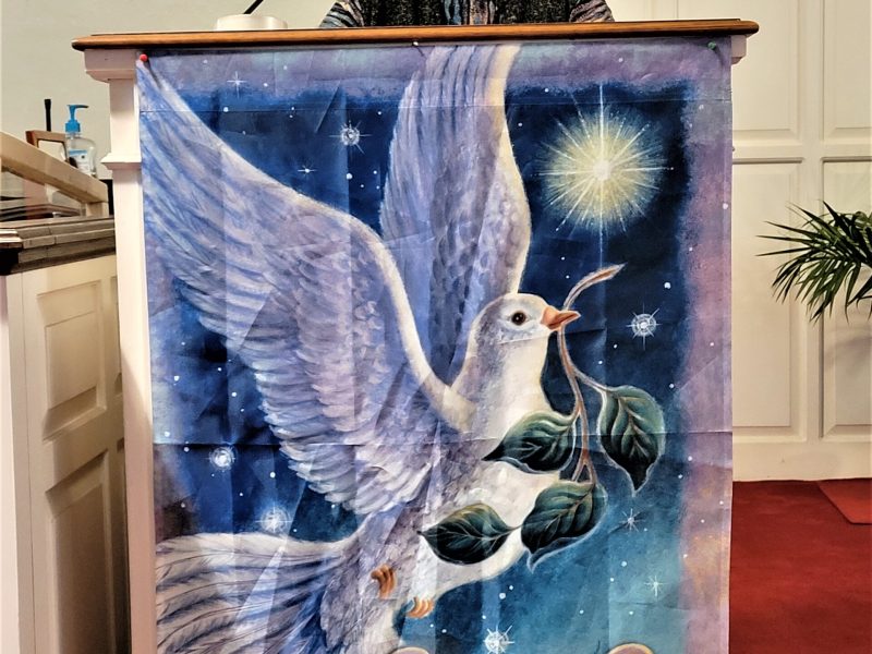 Pastor Barbara Blom in the pulpit of the Groton Community Church, United Church of Christ. She was called as the new pastor just prior to Easter 2023.