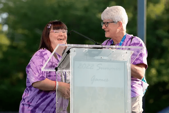Newfield's Amy Cusano (left) and her mother Paula (right) speak during the opening ceremonies of the 2022 Special Olympics New York Summer Games in. The event will be back in Ithaca from June 9-10 and volunteers are still needed.