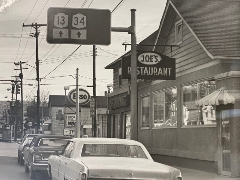 a black and white photo from the outside of Joe's