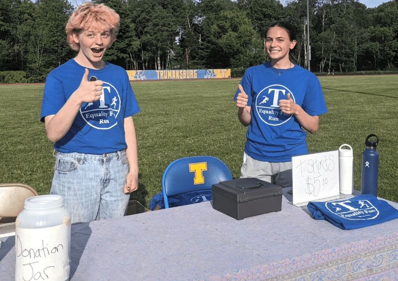 Lee Covell (left) and Izabel LaForge pose at the track used for the Equality Fun Run at Charles O. Dickerson High School in Trumansburg at last year’s Fun Run.