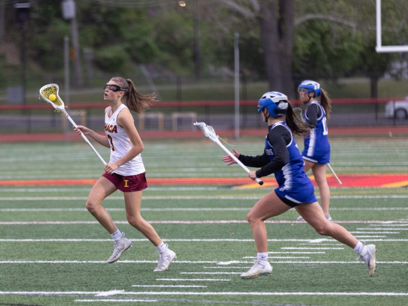 Ithaca High School's Julia Blakeslee carries the ball during the Section IV Class B Girls Lacrosse Championship against Horseheads on May 24 at Joe Moresco Stadium. The senior led the way with six goals en route to a 16-3 win, the Little Red's first sectional title since 2021.