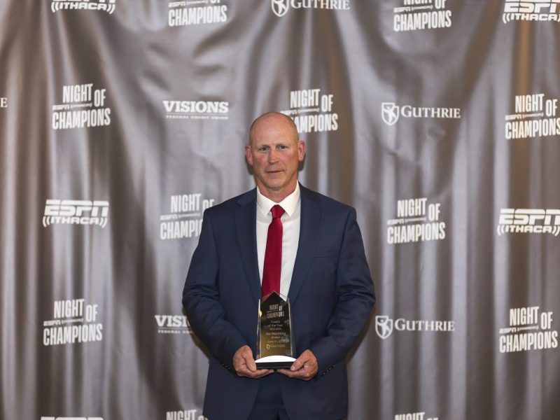 Groton football head coach Joe Manning holds his ESPN Ithaca Coach of the Year trophy during the 10th annual Night of Champions awards ceremony on June 11. Manning led the program to a 11-1 record and an appearance in the 8-man regional championship.
