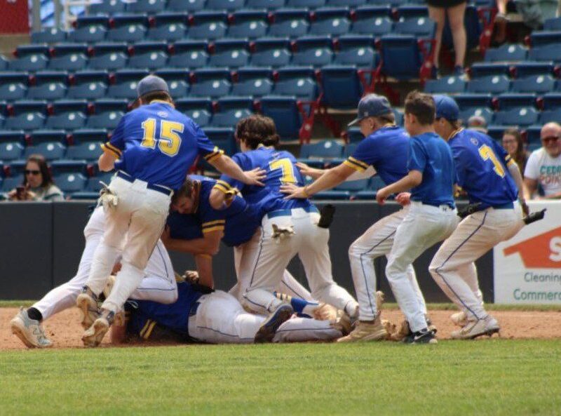 The Lansing baseball team dogpiles Korbin Lovejoy by first base following the Bobcats' 4-3 walk-off win in the NYSPHSAA Class B Regionals against Skaneateles on June 3 at Mirabito Stadium. The Bobcats went on to make their first state championship appearance since 2012, where they would lose to Depew 5-4.