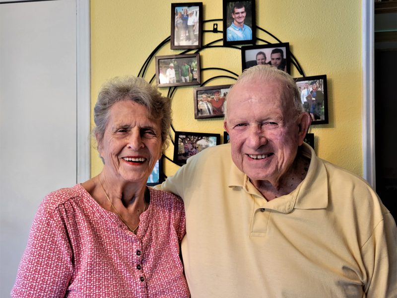 Arlene (left) and Jerry Caward Sr. in their home on Atwater Road, Lansing with a background of just a few of the many family photos proudly displayed there. The Cawards will celebrate their 70th anniversary on June 26.