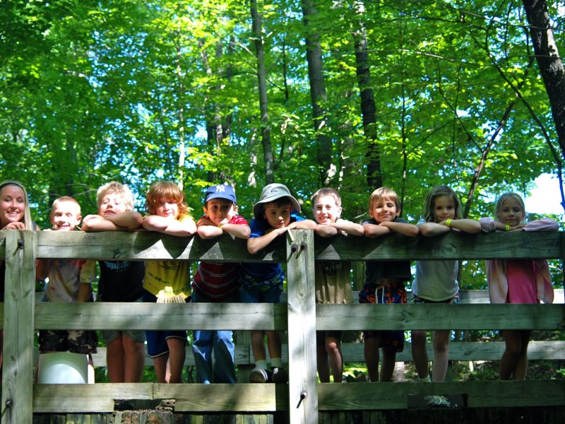 A camp counselor and group of children visit the Cayuga Nature Center for their 2022 Summer Celebration.