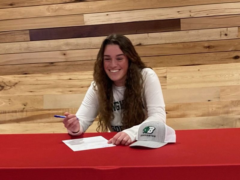 Elisa signing her college sports contract