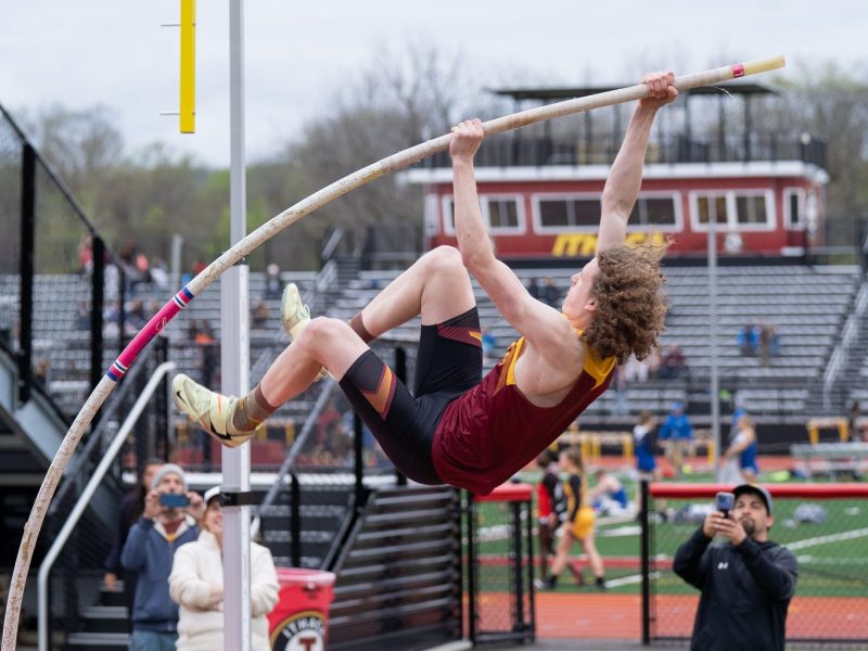 Athlete vaulting with pole