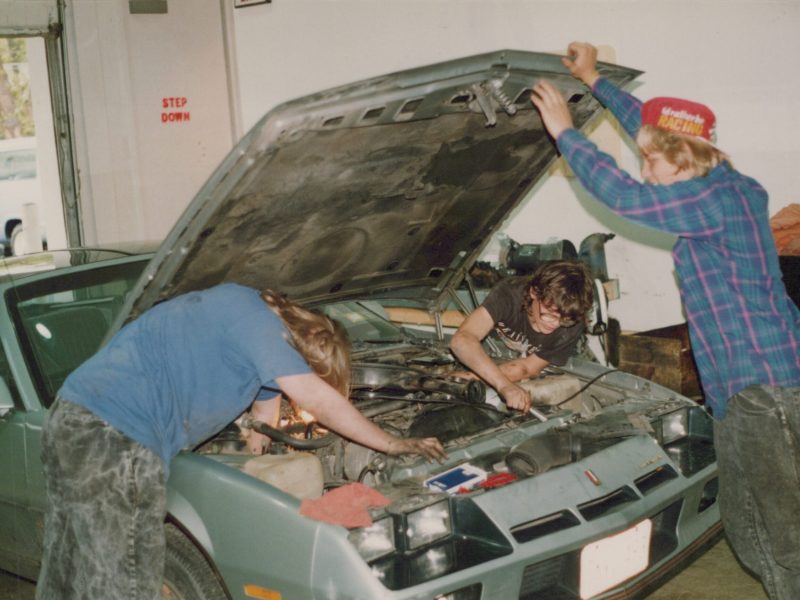People working on car