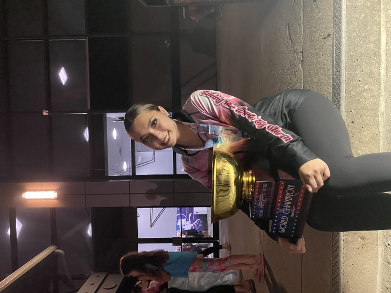 Alea sitting with her world champion trophy