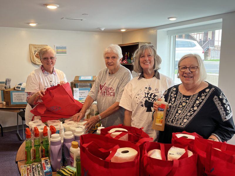 Jami Breedlove-Crouch, Judy Jones, Mary Clabby, and Shella Chace lead their respective churches’ donation and volunteer efforts with The Village at Ithaca. Here, they are packing household bags for different families across the Ithaca area.