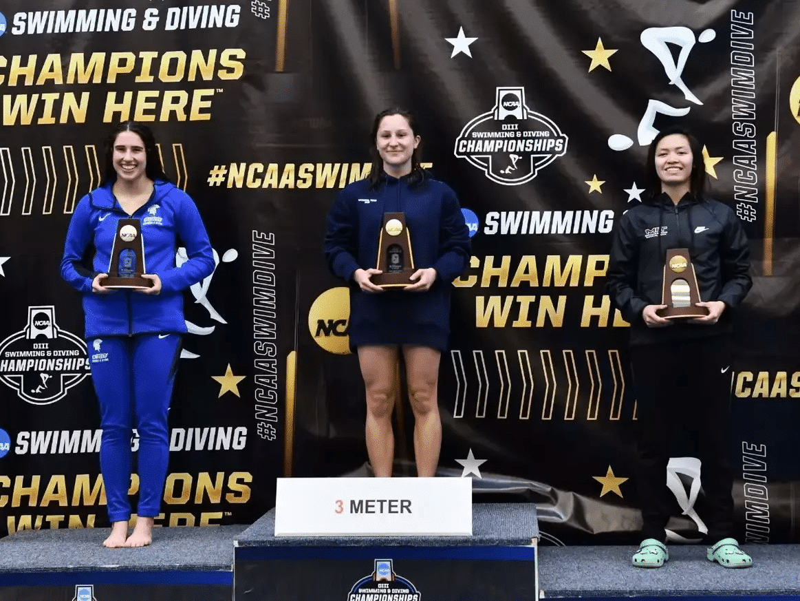 Ithaca College's Kailee Payne (middle) poses with one of her two national diving championships she captured this year. The Freeville native repeated what she achieved last season by winning off the one-meter and three-meter boards. Also pictured: Case Western's Abigail Wilkov (left) and MIT's Fiora Beratahani (right).
