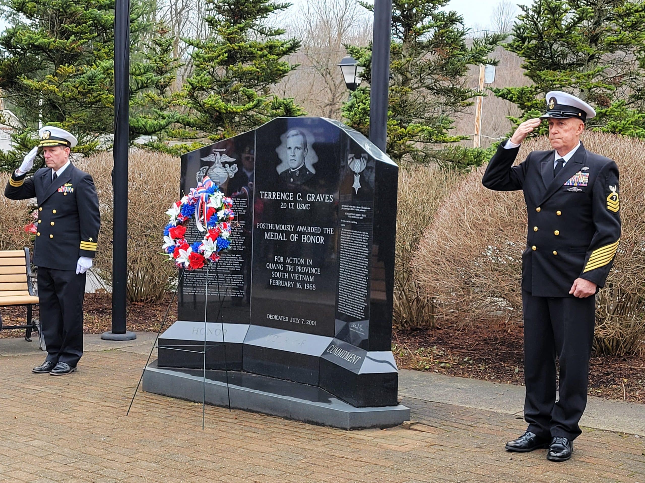 Photo by Linda Competillo 
As part of the Groton American Legion Carrington-Fuller Post 800’s recognition of National Vietnam War Veterans Day on March 29, retired US Navy Commander Wade Landis (left) and retired US Navy Chief Petty Officer Thane Benson, commander and immediate past commander, respectively, for the VFW (Veterans of Foreign Wars) Post 7127, Moravia, had just completed the wreath-laying ceremony at the memorial of Terrence Graves, honoring his service to his country. Graves was a U.S. Marine Corps Medal of Honor recipient who lived in Groton and died serving his country in Vietnam in February 1968.
