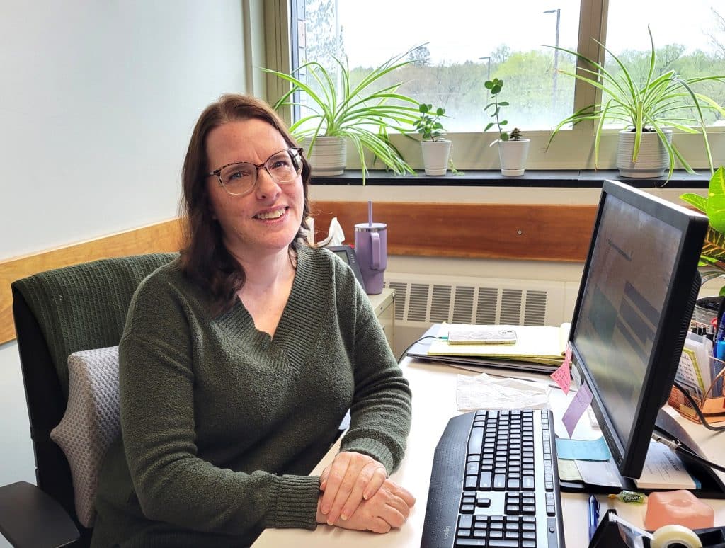 Monica Dykeman, Program Director, 21st Century Community Learning Center Grant, Groton Central School, sits at her desk in the GCS STEAM Center, making plans for the district’s more than 50 camps and activities offered this summer – free to Groton residents through this grant.