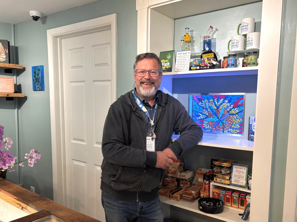 Photo provided 
John Friedman behind the counter of his new business, cannabis dispensary Corner House, which he co-owns with his wife, Joan Friedman. 