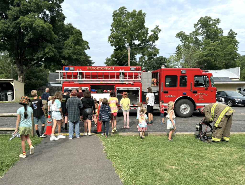 Photo provided
Campers gather around a firetruck during last year’s Brooktondale Summer Camp. This summer, the camp begins on June 30. 