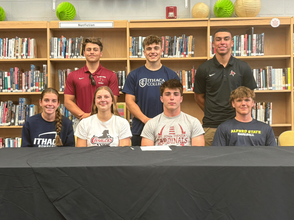 Photo by Ryan Gineo
On June 9, Trumansburg held a "Signing Day" celebration to recognize seven student-athletes who will be continuing their careers at the collegiate level. Top row (left to right): Lucas Grove, Quinn Van Valen, Nik Nelson. Bottom row (left to right): Raya Mount, Amara Landon, Dikota Hamilton, Owen Fulton. 