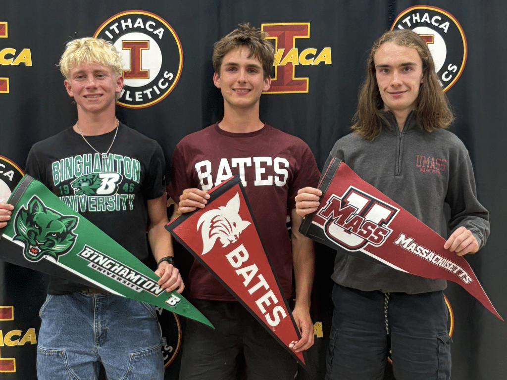 Photo by Ryan Gineo.
On June 12, Ithaca High School recognized 18 students who will continue their athletic and academic careers in college. Among those honored were a trio of cross country and track & field athletes (left to right): Noah Hilker (Binghamton), Everett Shaw (Bates) and Riley Hubisz (UMass).