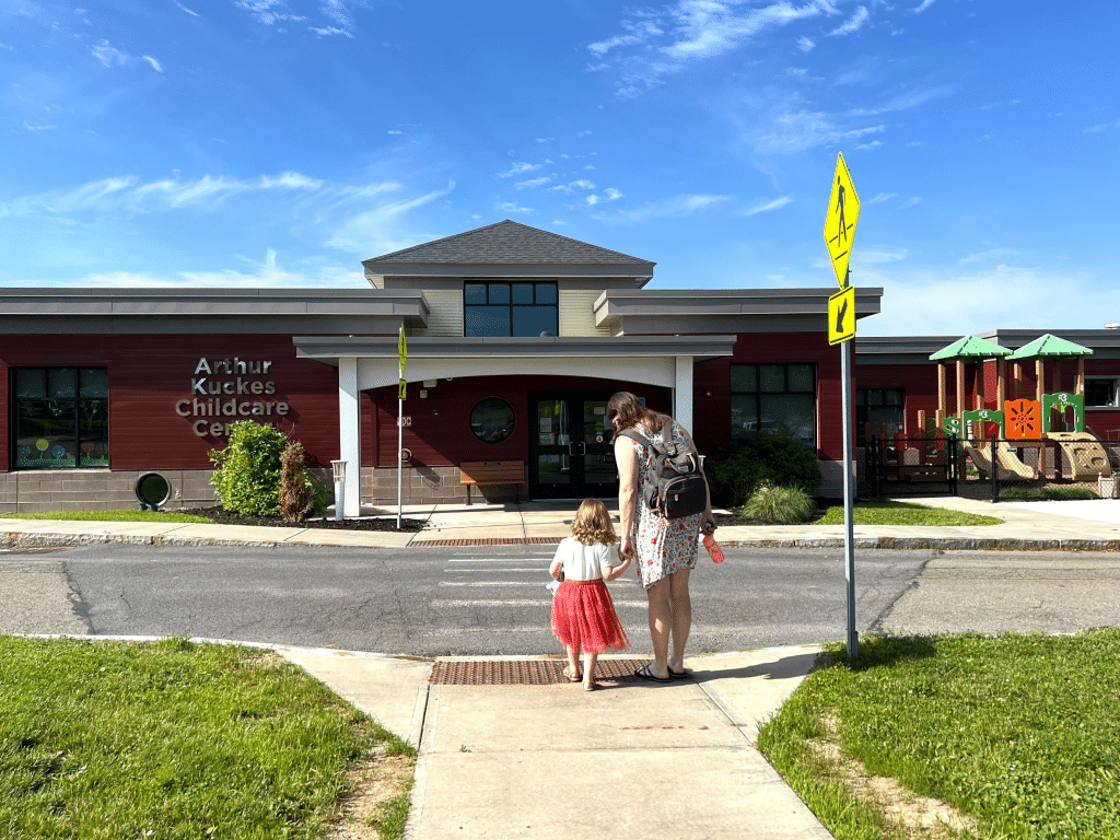 Photo by Jaime Cone Hughes 
Christine Sislak, of Freeville, drops off her daughter, Abigail Wendel, at Tompkins Cortland Community College’s Arthur Kuckes Childcare Center, where students and community members have access to affordable child care while students in the college’s Early Childhood program have access to real-world learning experiences. TC3 Workforce Training