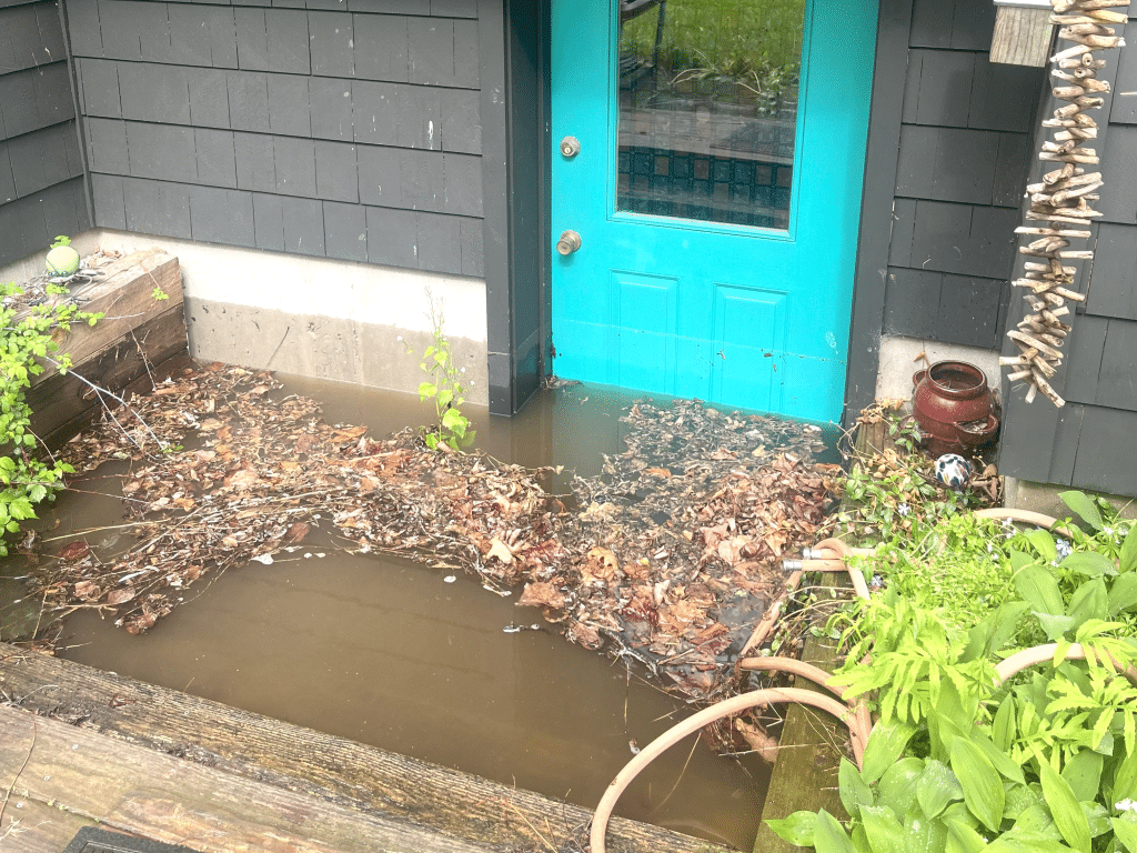 The finished basement of P.J. and Casey Beck’s Trumansburg home was flooded with 8 inches of water after this stairwell filled with rain during a thunderstorm in May. Trumansburg Flood Risk
