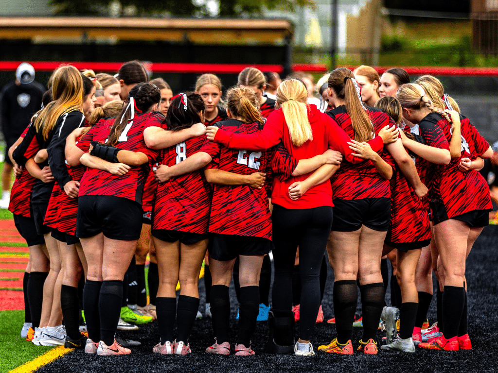 Photo by John Brehm
The Groton girls soccer team huddles up before its game against Lansing on September 17. The Red Hawks are looking to defend their IAC title and make a deeper run in sectionals.