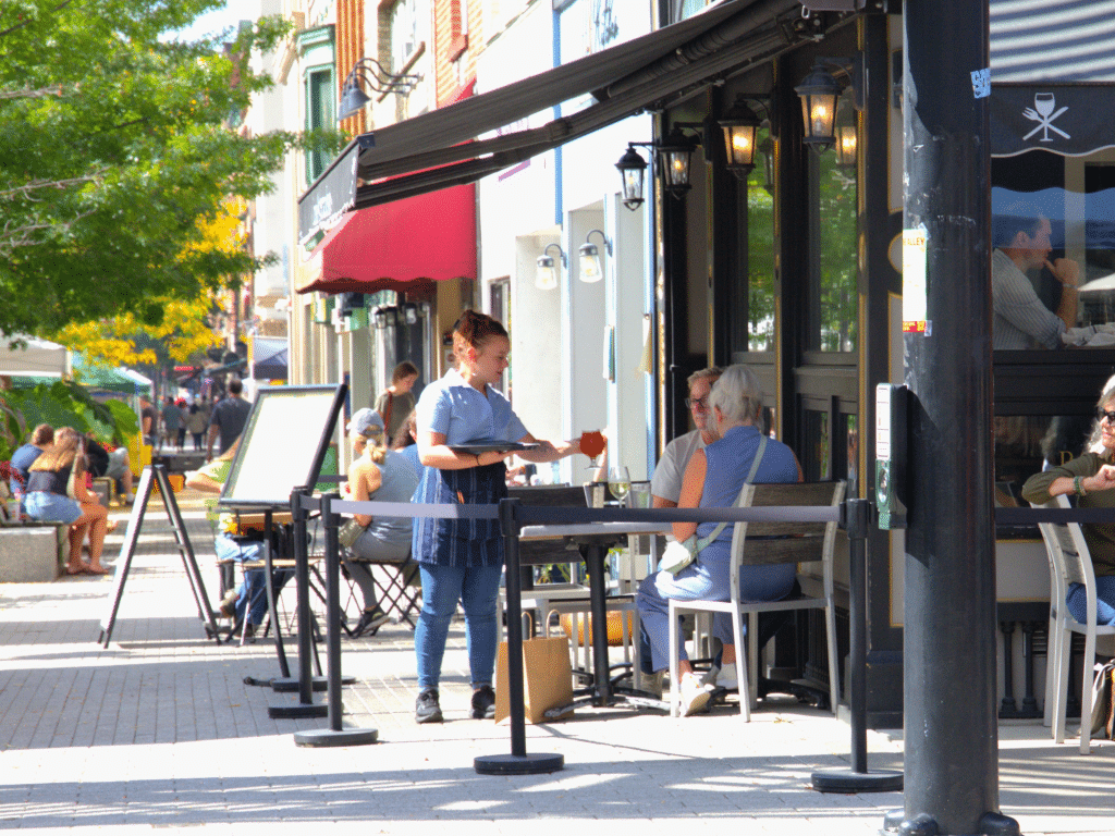 Photo by Jaime Cone Hughes 
Opponents to the implementation of “just cause” worker protections in the city of Ithaca say the legislation would be harmful to small businesses like the eateries that make up “Restaurant Row” and The Commons downtown. Pictured here: Diners eat lunch at Simeon’s American Bistro and Lev Kitchen. 