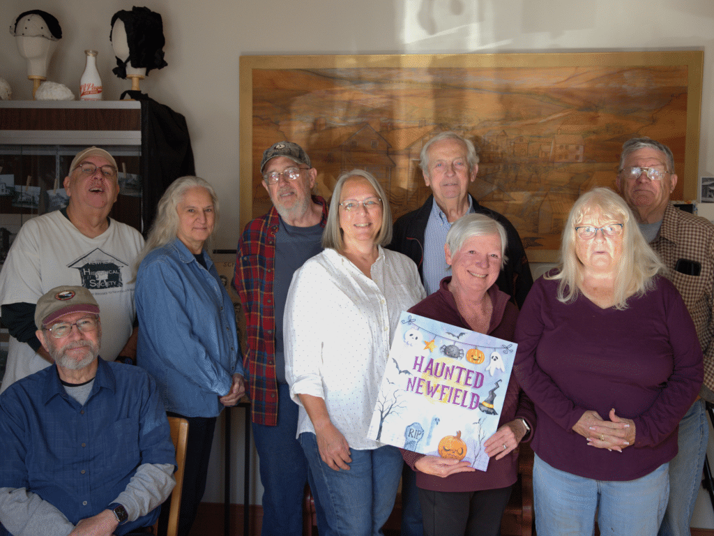 Photo by J.T. Stone
Back row from left: Newfield Historical Society volunteers Jon Armstrong, Liane Delong, Jim Haustein, Alan Chaffee, who also serves as the town historian, and President Larry Miller. Front row from left: NHS volunteers Kevin Ingerson, Joleen Krogman, Marie Gilbert and Barb Trask.        
