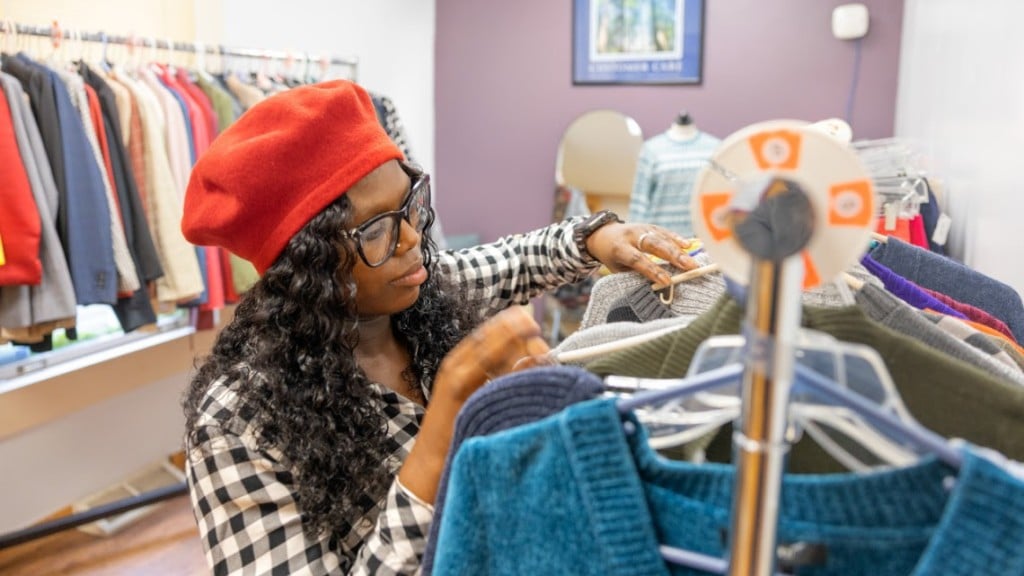 Photo by Ryan Young/Cornell University
Ronnise Way, manager of the Women’s Opportunity Center, arranges clothing at the center’s Opportunity Boutique. The Women’s Opportunity Center is one of nearly 60 Ithaca-area agencies funded by the Cornell United Way campaign.