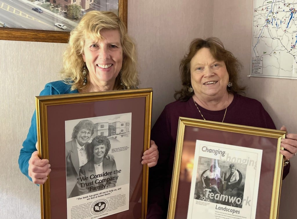 Photo by Jaime Cone Hughes
Chris Wallace (left) and Darlene Reynolds hold up framed advertisements for Tompkins Trust Company that feature sisters Dorothy Petrulis and Marilyn Ryan, who co-owned Royal Court restaurant in Ithaca for 50 years. Wallace, who is Ryan’s daughter, and Reynold’s, the restaurant’s general manager, said they are heartbroken to see the restaurant close its doors.
